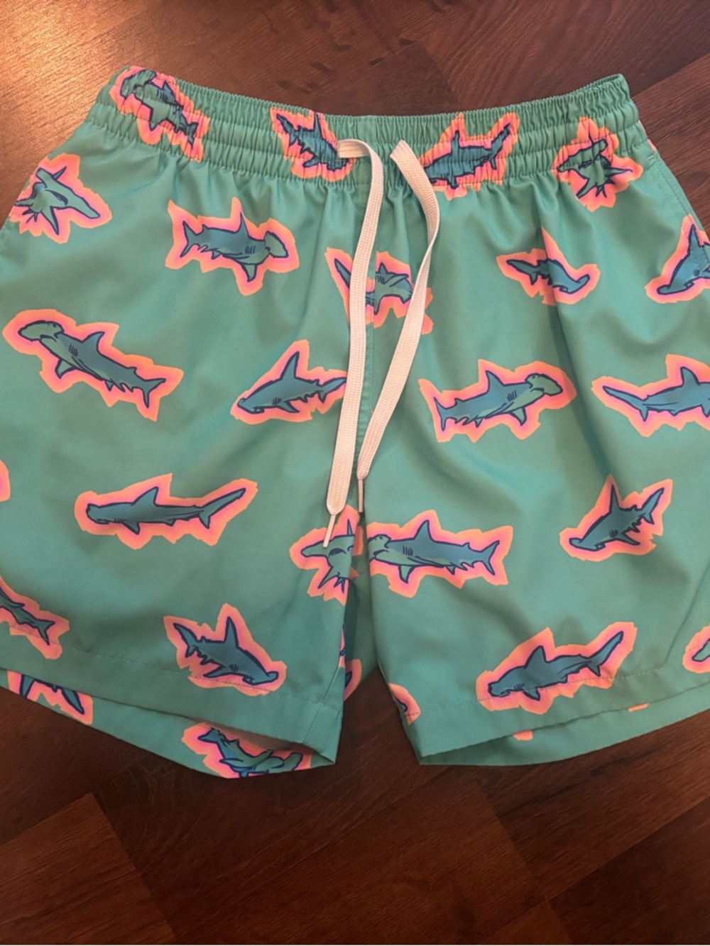 chubbies Teal Swim Trunks with Pink and Blue Shark Print
